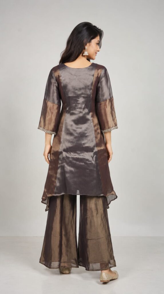 3 Piece Suit In Shimmer Fabric, Cut Dana Work Done On Neck And Sleeves With Sharara Pant Paired With Shimmer Fabric Dupatta.